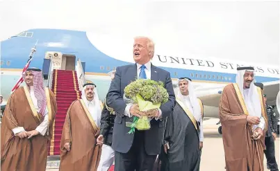  ??  ?? President Donald Trump is welcomed to Saudi Arabia by members of the Saudi royal family.