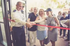  ?? (Courtesy) ?? FROM LEFT: An Israel Navy officer helps Dr. Jack, Tamara and Alana Faintuch cut the ribbon to dedicate the Robert Neal Sklare Sports Center at the Haifa Naval Base.