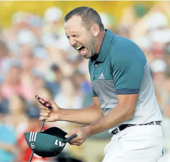  ?? MATT SLOCUM/AP ?? Sergio Garcia reacts after making his birdie putt on the 18th green to win the Masters Sunday in Augusta, Ga.