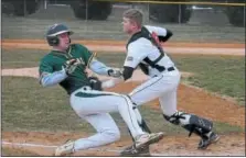  ?? GENE WALSH — DIGITAL FIRST MEDIA ?? Lansdale Catholic’s Shane Stewart is tug out going home by William Tennent’s Kip Mooney.