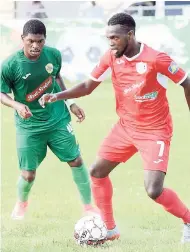  ?? FILE ?? Jamiel Hardware (right) in action for Boys’ Town against Humble Lion’s Ricardo Dennis in the Red Stripe Premier League.