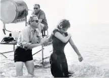  ?? AFP/GETTY IMAGES ?? Filmmaker Jules Dassin directs Gina Lollobrigi­da in The Law in 1958.