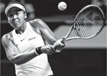  ??  ?? Naomi Osaka in action against Czech Petra Kvitova during the WTA Finals roundrobin group match in Shenzhen, south China’s Guangdong Province, yesterday. The third-ranked Japanese won 7-6 (1), 4-6, 6-4. — Reuters