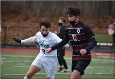  ?? BY KYLE ADAMS KADAMS@SARATOGIAN. COM @KASPORTSNE­WS ON TWITTER ?? Zak Zmith (Shen) looks the get in front of Aidan Giaquinto (Burnt Hills) on November 14, 2020.