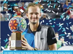  ?? ?? LOS CABOS: Russia’s Daniil Medvedev holds the winning trophy after defeating Britain’s Cameron Norrie during their Mexico ATP Open 250 men’s singles final tennis match at the Cabo Sports Complex in Los Cabos, Mexico, on August 6, 2022. — AFP