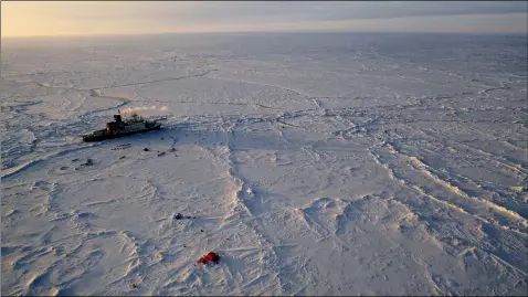  ?? MANUEL ERNST — ALFRED-WEGNER-INSTITUT VIA AP ?? The German Arctic research vessel Polarstern is in the ice next to a research camp April 24in the Arctic region.