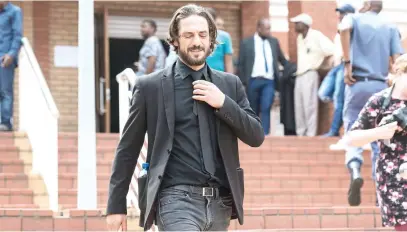  ?? Picture: Michel Bega ?? DEBT TO SOCIETY. Convicted racist Adam Catzavelos leaves the Randburg Magistrate’s Court after he was sentenced to a R50 000 fine or a wholly suspended two-year jail term.