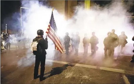  ?? Marcio Jose Sanchez Associated Press ?? TEAR GAS, which traditiona­lly has been a defensive tool and a last resort, shrouds a Black Lives Matter protest July 30 in Portland, Ore.