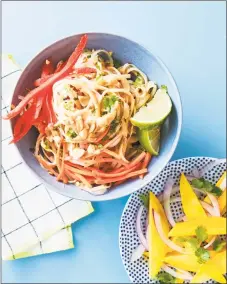  ??  ?? Rice noodles topped with Thai Peanut sauce, shredded carrots, sliced bell peppers, and chopped peanuts.