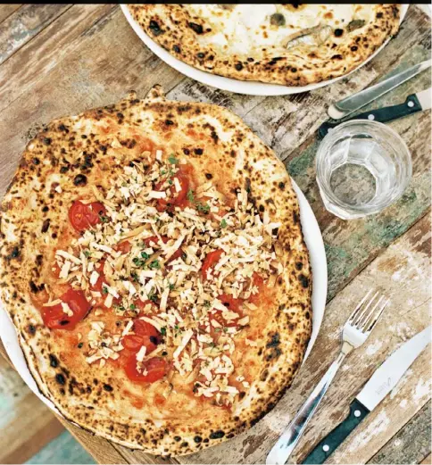  ??  ?? Franco Manca’s pizza with tomato, nepetella and baked ricotta (recipe overleaf)