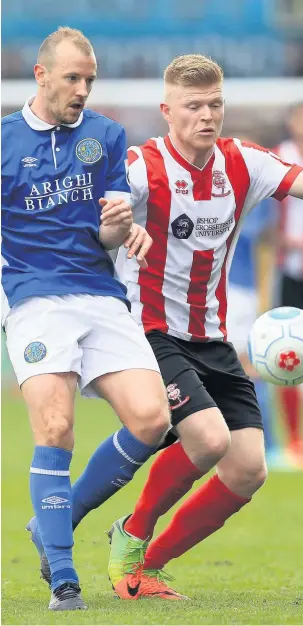  ?? Nigel French ?? Lincoln City’s Elliott Whitehouse and Macclesfie­ld’s Luke Summerfiel­d battle for the ball at Sincil Bank