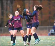  ?? David G. Whitham / For Hearst Connecticu­t Media ?? Foran’s Anna Lee Melton, center, and Colleen Ardolino celebrate Ardolino’s first goal of their match against Bristol Eastern on Tuesday.