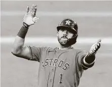  ??  ?? Carlos Correa celebrates his seventh-inning double.