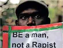  ?? ?? A MAN holds a placard as Indian Christians and others condemn the gang rape of a nun at a Christian missionary school in eastern India in Kolkata, India, in 2015. | AP