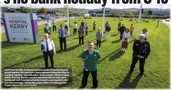  ?? Photo by Domnick Walsh ?? Staff from the HSE, An Garda Siochna and Kerry County Council joined together this week for a photo demonstrat­ing that they’re standing together – but still apart – in the county’s battle to keep COVID-19 at bay. Doctors, nurses, mental health services staff, Gardaí and staff from Kerry County Council came together with one main message – asking the people of Kerry to keep up their Trojan efforts.