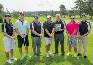  ?? JENELLE SCHNEIDER/ PNG ?? Participan­ts in the Rotary Club tournament in honour of Pat Dooley included his dad Steve ( shown holding book). Pat was an avid golfer and member of the Elgin Park golf team.