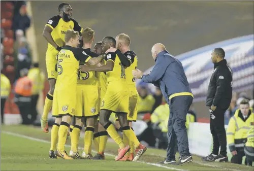  ??  ?? New Barnsley manager José Morais can only look on as Burton Albion celebrate their second goal scored by Jacob Davenport. HARD TO WATCH: PICTURE: BRUCE ROLLINSON