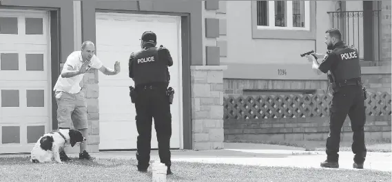  ?? NICK BRANCACCIO/WINDSOR STAR ?? This photo taken on June 14, 2017 earned veteran Windsor Star photograph­er Nick Brancaccio the Ontario Newspaper Award for spot news photograph­y for newspapers with more than 25,000 circulatio­n. In the award-winning image, police arrest a man following...