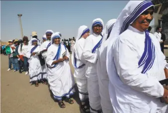  ?? Khaled Desouki / AFP / Getty Images ?? Christian nuns line up to attend a Mass celebratio­n by Pope Francis at a stadium in the Egyptian capital of Cairo. Security was exceptiona­lly tight around the stadium.