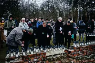  ?? ?? Candles are lit in the ruins of Auschwitz - Birkenau (Getty)