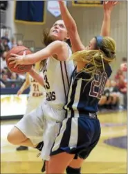  ?? PETE BANNAN-DIGITAL FIRST MEDIA ?? Boyertown’s Kylie Webb (13) puts a shot up as Cardinal O’Hara’s Hannah Nihill (20) defends during the first half.