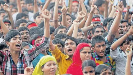  ??  ?? Garment workers shout slogans during a rally demanding an increase to their minimum wage in Dhaka yesterday. About 50,000 garment industry workers held their largest protest so far in the Bangladesh­i capital to demand an increase in the minimum wage,...