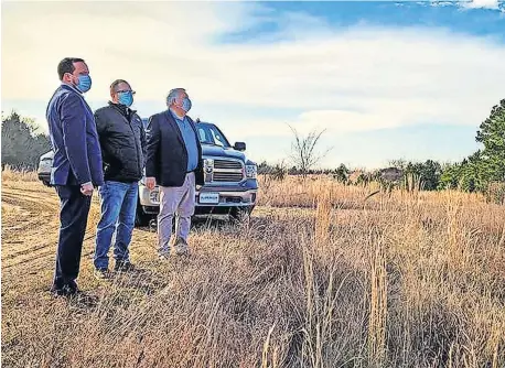  ??  ?? Cherokee Nation Secretary of Natural Resources Chad Harsha and Tribal Councilors Daryl Legg and E.O. Smith tour a new hunting and fishing reserve area for tribal members in Sequoyah County on Monday. [PROVIDED]