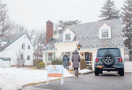  ?? TARA STRIANO/THE NEW YORK TIMES ?? People go to an open house in Port Washington, New York, on Feb. 27. Open houses across the region have drawn crowds as sales inventory has dwindled during the pandemic.