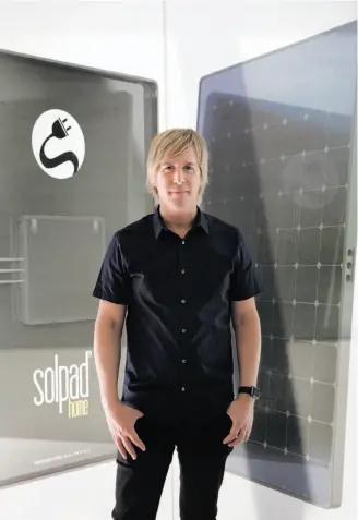  ?? Gabriella Angotti-Jones / The Chronicle ?? CEO Christophe­r Estes stands in front of a SolPad Home panel display in San Francisco.