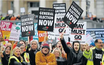  ?? Picture: REUTERS/HENRY NICHOLLS ?? CALL FOR NO BREXIT: Protesters hold banners as they participat­e in an anti-Brexit demonstrat­ion march in central London at the weekend. Pro and anti-Brexit protestors clashed on Saturday as MPs prepared for Tuesday’s decision whether or not to back the divorce deal struck between London and Brussels.