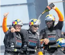  ?? Photo / Brett Phibbs ?? Jimmy Spithill and Oracle Team USA celebrate their remarkable comeback in San Francisco in 2013.