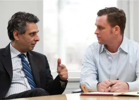  ?? NICK KOZAK FOR THE TORONTO STAR ?? Associate professor at Rotman School of Management Walid Hejazi, left. Student Trevor van Mierlo wanted to learn about doing business globally.