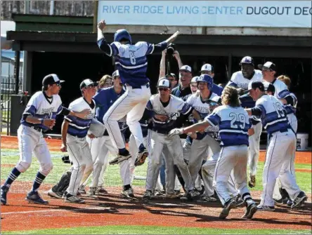  ?? STAN HUDY — SHUDY@DIGITALFIR­STMEDIA.COM ?? Saratoga Springs base runner Brian Hart leaps into the air and is about to descend onto home plate after hitting an eighth-inning walk-off home run against Shenendeho­wa on Friday afternoon at Amsterdam’s Shuttlewor­th Park.