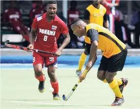  ?? FILE ?? Jamaica’s Nicholas Beach (right) in action against Panama’s Angelo Boodie in a Central American and Caribbean Games qualifier at the Mona Hockey field last year.