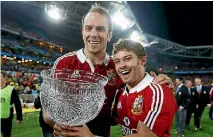 ?? PHOTO: REUTERS ?? British and Irish Lions’ Alun Wyn Jones (L) and Leigh Halfpenny celebrate with the Tom Richards trophy after winning their series over Australia after their third and final test at ANZ stadium in 2013.