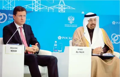  ??  ?? Saudi Energy Minister Khalid Al-Falih, right, and Russian Energy Minister Alexander Novak, speak at the Russian-Saudi Investment Forum in Moscow on Thursday. (SPA)