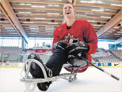  ??  ?? Dominic Larocque, of Quebec City, a former soldier who lost his leg in Afghanista­n and who now plays for the Canadian national sledge hockey team, practises with teammates in Calgary on Tuesday, Dec. 4, 2012.
