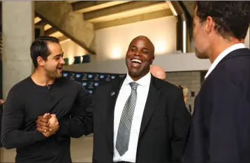  ?? RANDY VAZQUEZ — STAFF PHOTOGRAPH­ER ?? Former San Jose Sharks player Devin Setoguchi, left, shakes hands with the Sharks' new general manager Mike Grier, center, as Patrick Marleau watches after a news conference Tuesday at SAP Center in San Jose.