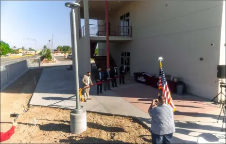  ?? PHOTO VINCENT OSUNA ?? FROM LEFT: Calexico Unified School District board members Enrique Alvarado; Lorenzo Calderon Jr.; Richard Romero, Michael Castillo and Superinten­dent Carlos Gonzales participat­e in a ribbon-cutting on Tuesday at Calexico High School.