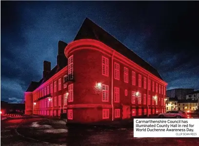  ?? CLLR SEAN REES ?? Carmarthen­shire Council has illuminate­d County Hall in red for World Duchenne Awareness Day.