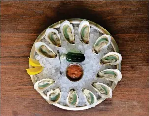  ?? CONTRIBUTE­D BY WATCHMAN’S SEAFOOD AND SPIRITS ?? Available for a limited time, Divine Pine oysters from North Carolina can be found at Watchman’s Seafood and Spirits at Krog Street Market in Atlanta.