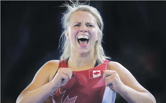  ?? ANDY BUCHANAN/AFP/ GETTY IMAGES ?? Wrestler Erica Wiebe admits “it’s hard to be an athlete in Canada,” given the tight budgets athletes must live under in pursuit of Olympic glory.