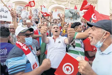  ?? REUTERS ?? Supporters of President Kais Saied rally in support of his seizure of power in Tunis on Sunday.