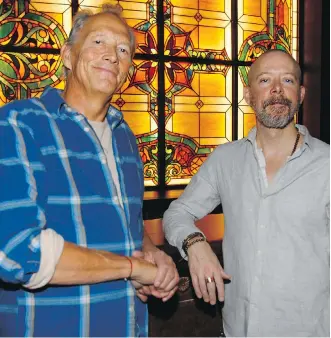  ?? PHOTOS: DEAN PILLING ?? Witold Twardowski, left, and Nathan Head at the Confederat­ion Cafe and Cocktail Bar, which features repurposed furniture and decor items, including stained glass windows behind the bar.