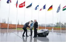  ?? | AFP ?? NATO Secretary-General Jens Stoltenber­g lays a wreath during a ceremony marking the alliance’s 75th anniversar­y at the Flag Circle outside Nato Headquarte­rs in Brussels yesterday.