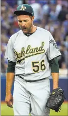  ?? FRED THORNHILL — ASSOCIATED PRESS ?? A’s starting pitcher Chris Smith lost his first game of the season.