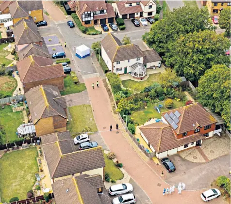  ??  ?? Armed police officers outside a property on Westwood Avenue, Ipswich, left, a few miles from Friends Walk on the Grange Farm developmen­t in Kesgrave, above, where police were called to reports of the shooting