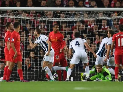  ??  ?? Gareth McAuley celebrates scoring West Brom's consolatio­n goal (Getty)