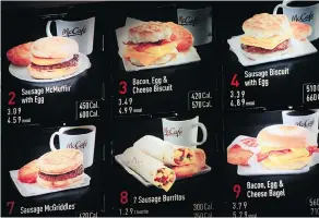  ?? MARK LENNIHAN / THE ASSOCIATED PRESS FILES ?? Some items on the breakfast menu are posted at a Mcdonald’s.