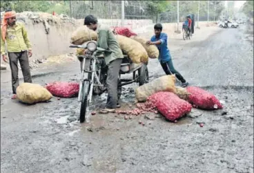  ?? MOHD ZAKIR/HT PHOTO ?? A potholed road in Dallupura in east Delhi. All roads up to 60feet wide are managed by the municipal corporatio­ns.